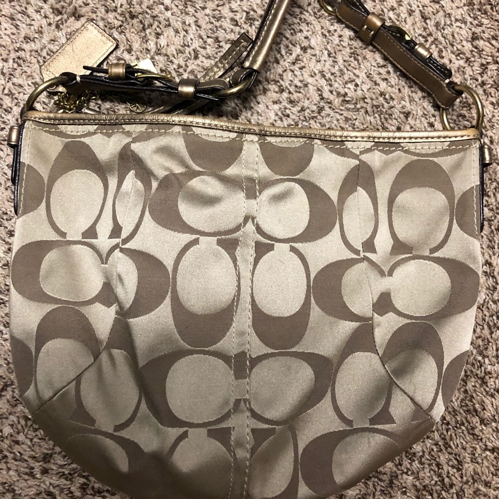 Gold coach bag
